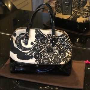 Kate Spade Pocketbook with protective bag.
